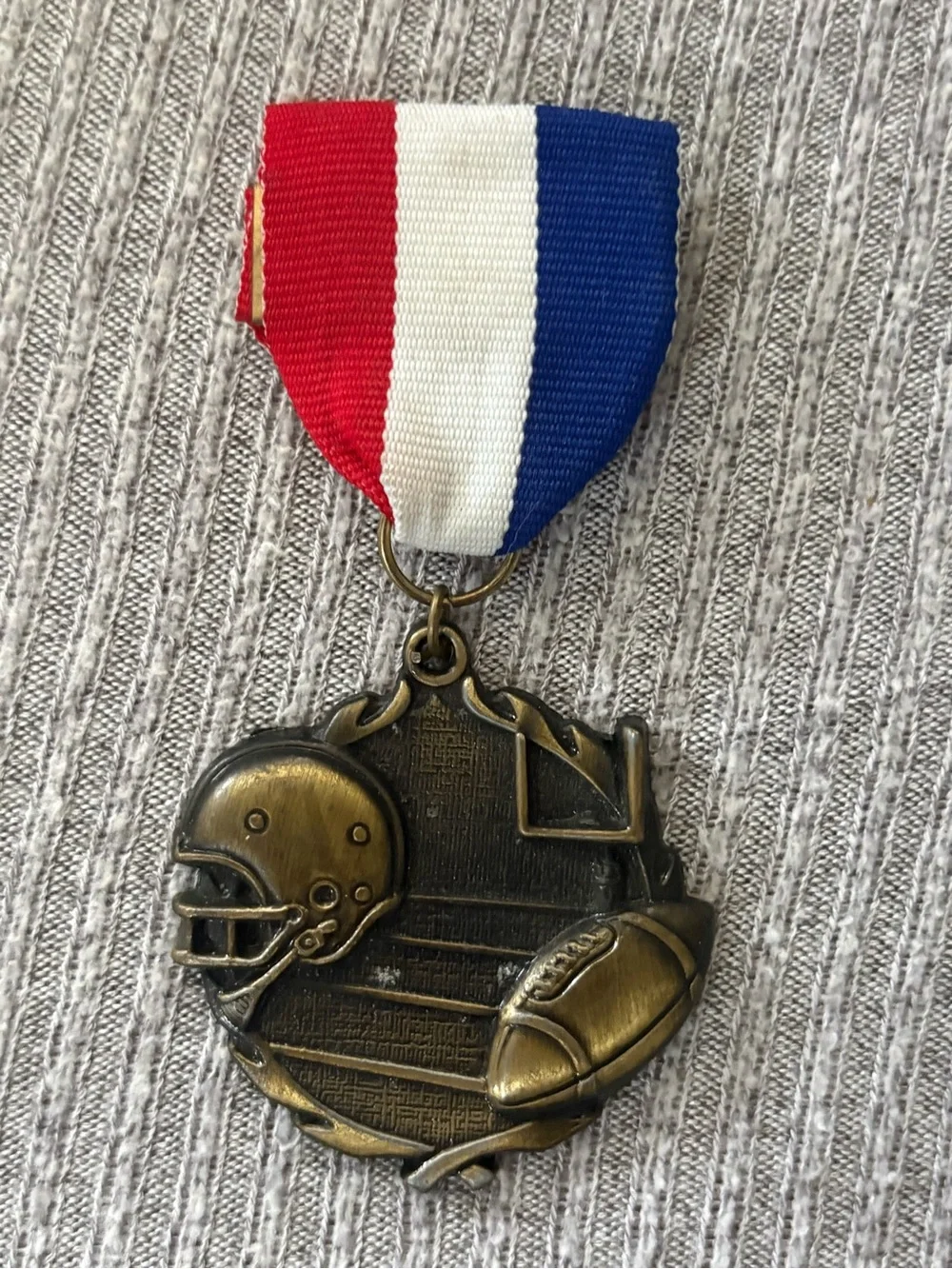 PDU marked bronze tone round football & helmet medal brooch w multicolor ribbon